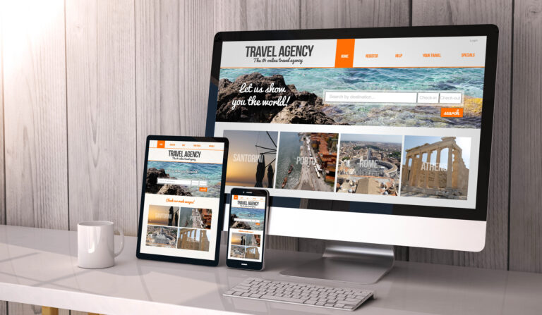 A desktop, tablet, and smartphone display a responsive view of a travel agency website.